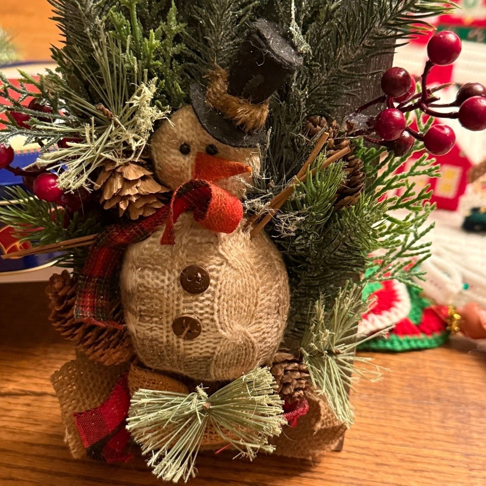 Rustic snowman decoration knitted snowman figurine on reclaimed wood panel